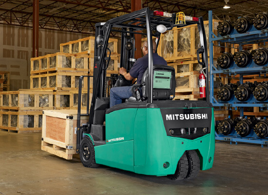 3 Wheel forklift being used in a warehouse