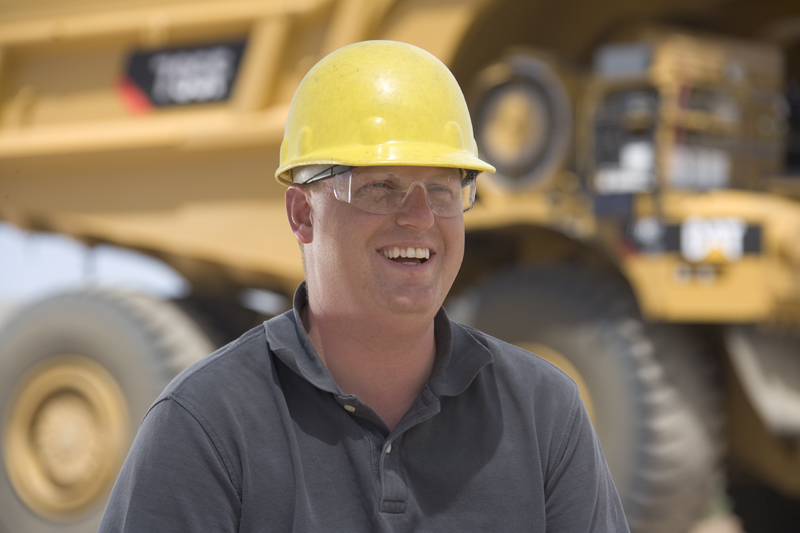 Man wearing eye protection and a hard hat